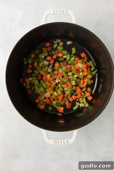 stir-fried vegetables in a pan on a white surface.