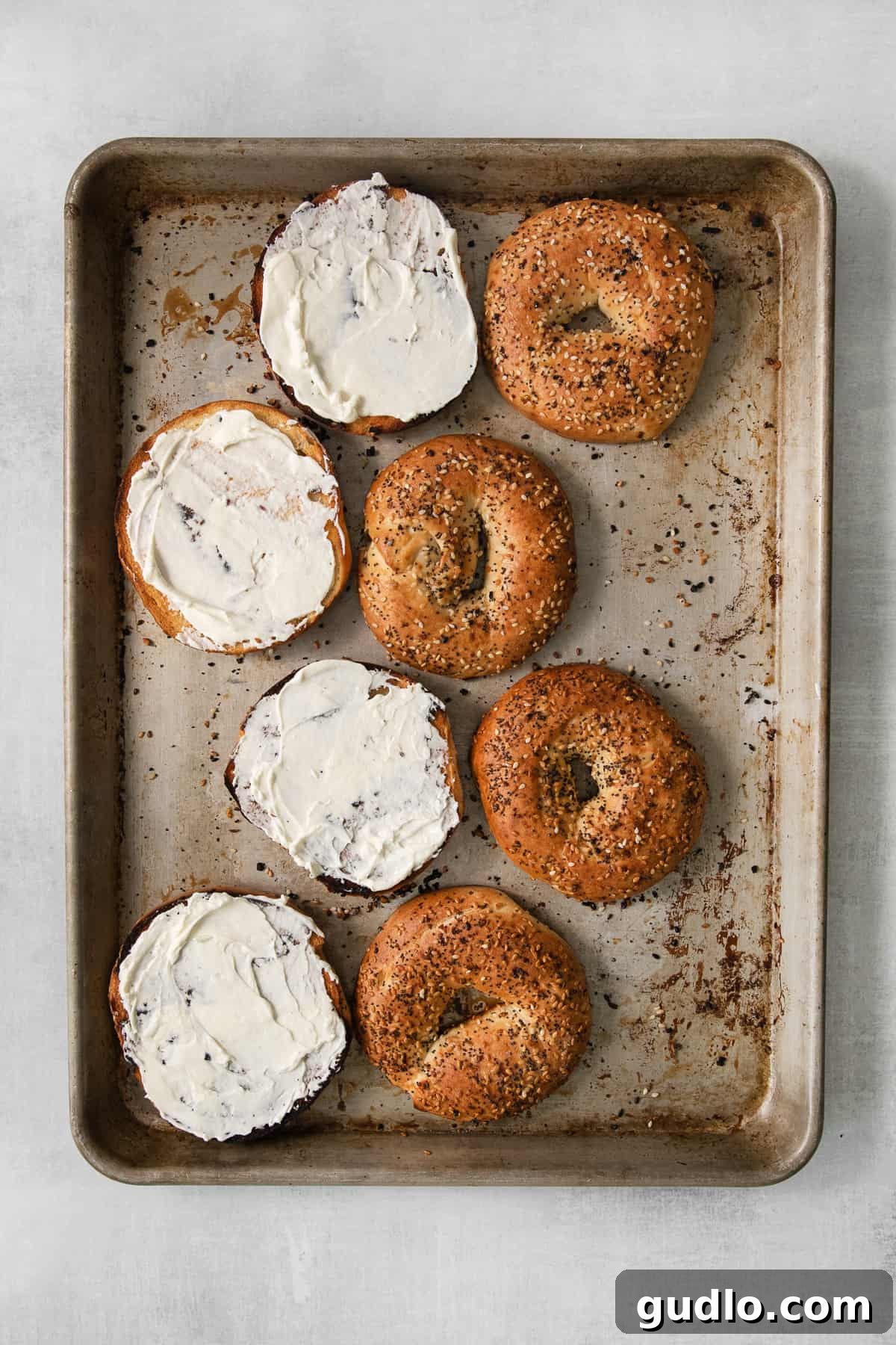 Hearty Morning Bagel Stack 8 Toasted bagel halves generously spread with cream cheese, ready for the other breakfast fillings.