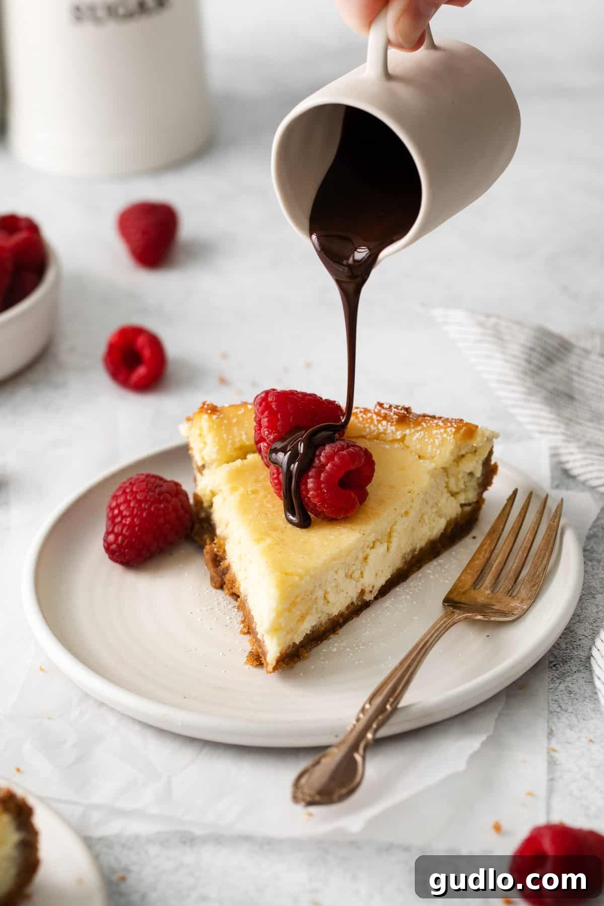 A slice of ricotta cheesecake topped with chocolate shavings, offering an alternative topping idea.