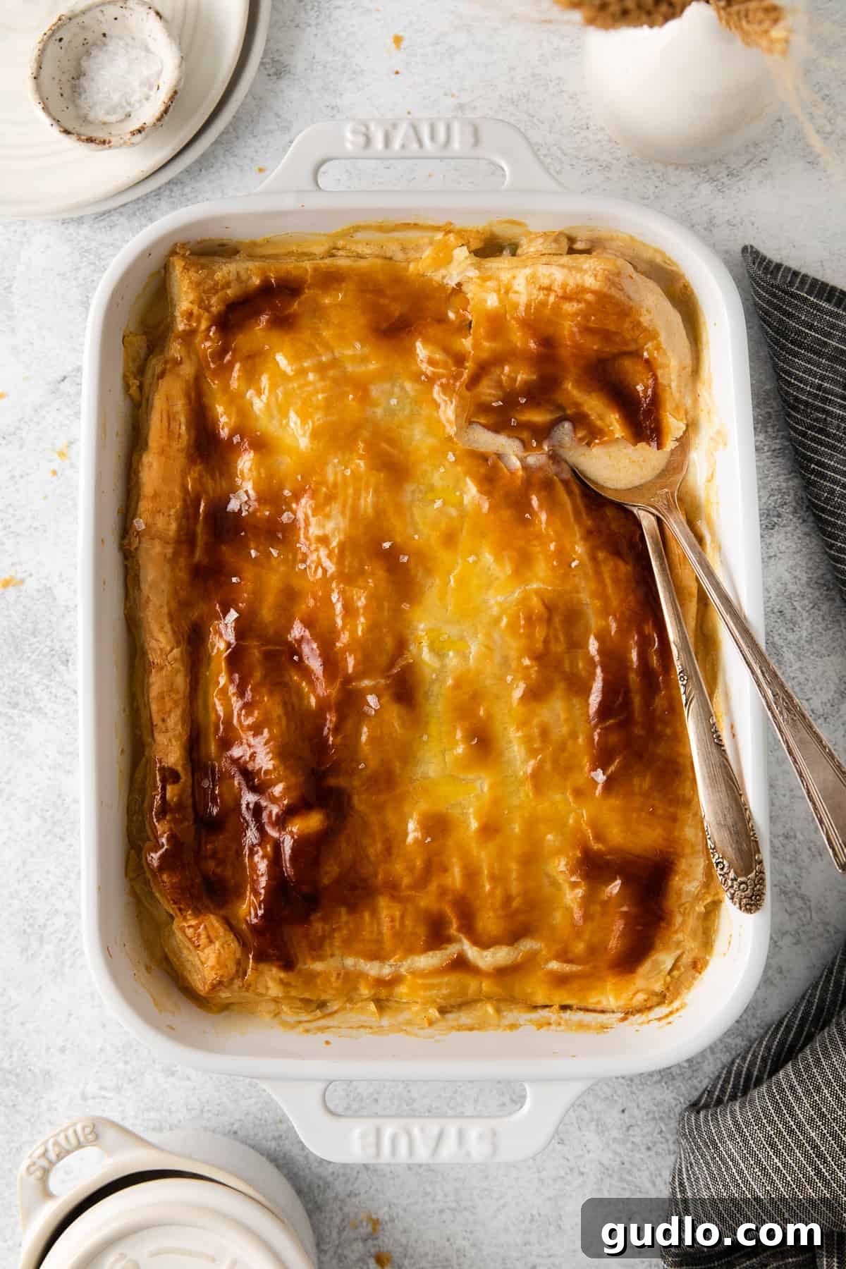 Baked Chicken Pot Pie Casserole Freshly baked chicken pot pie casserole, topped with a golden and flaky puff pastry crust.
