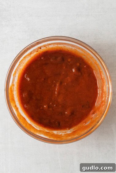 No-Fuss Totchos 3 A bowl of vibrant taco sauce, ready to be mixed into the beef.