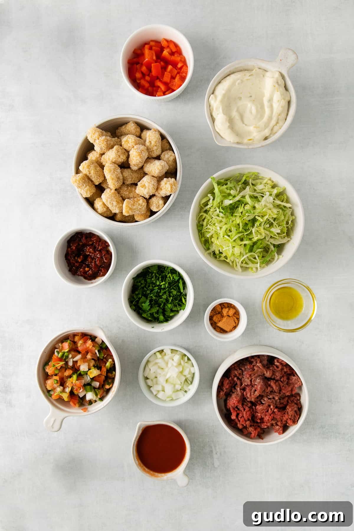 Fresh Totchos Ingredients Bowls filled with the fresh ingredients for totchos, ready for assembly.