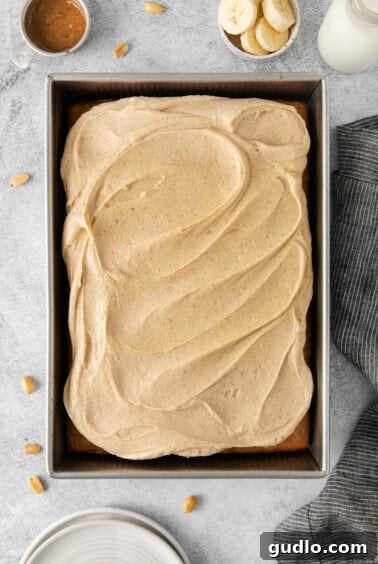 Frosted banana cake in a pan.