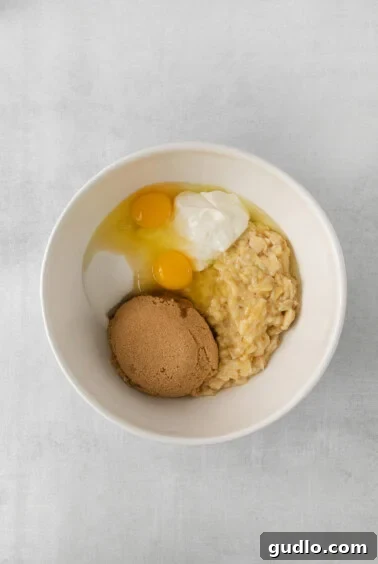 Wet ingredients for banana cake in a bowl.