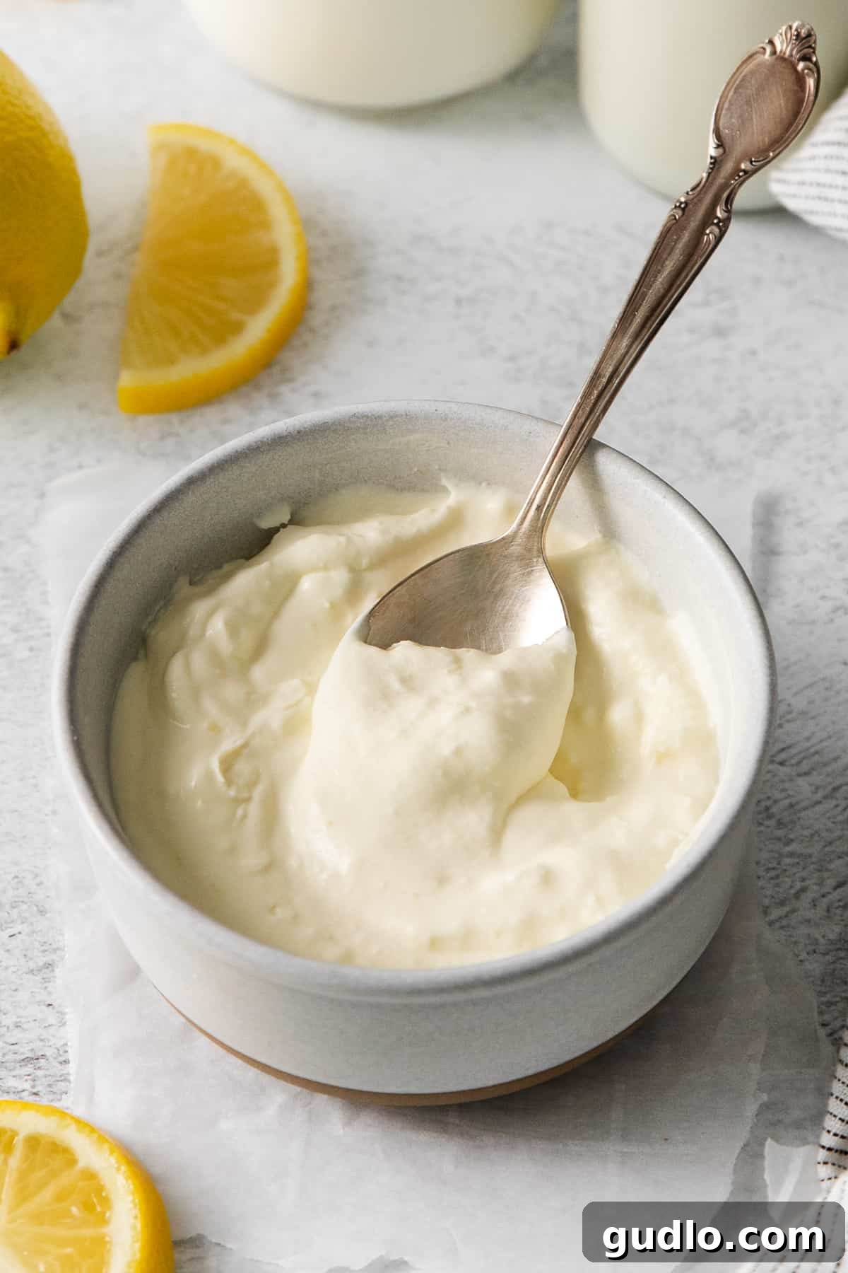 Freshly made homemade mascarpone cheese in a ceramic bowl, ready to be used in various recipes.