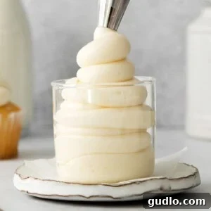 Divine Limoncello Mascarpone Cake 2 Close-up of fluffy mascarpone frosting in a glass bowl, ready to be used on a dessert.