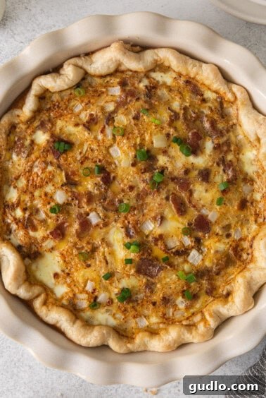Classic French Quiche Lorraine 8 A fully baked Quiche Lorraine in a pie plate.