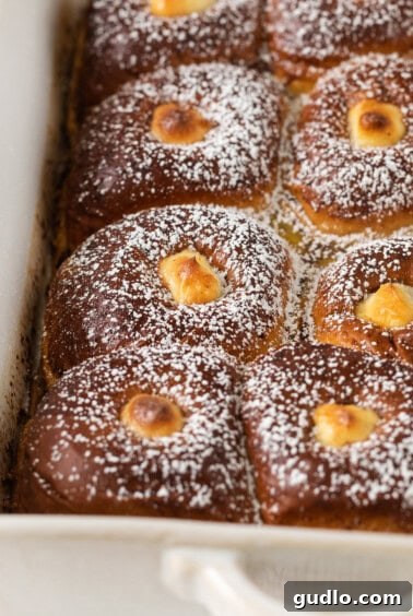 Baked Stuffed Hawaiian Roll French Toast casserole, golden and bubbly from the oven.