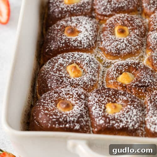 Stuffed Hawaiian Roll French Toast in a casserole dish, ready to be served.
