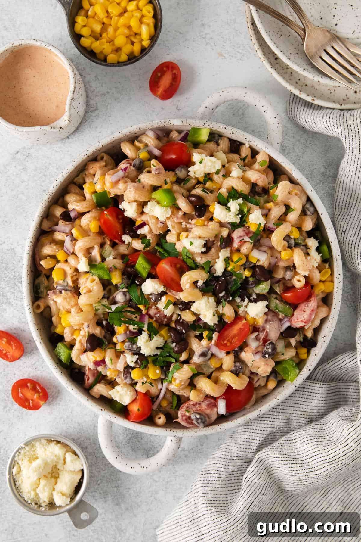 Fiesta Pasta Salad 9 A beautifully presented bowl of Mexican pasta salad, generously topped with fresh cilantro, ready to be savored as a delicious side dish.