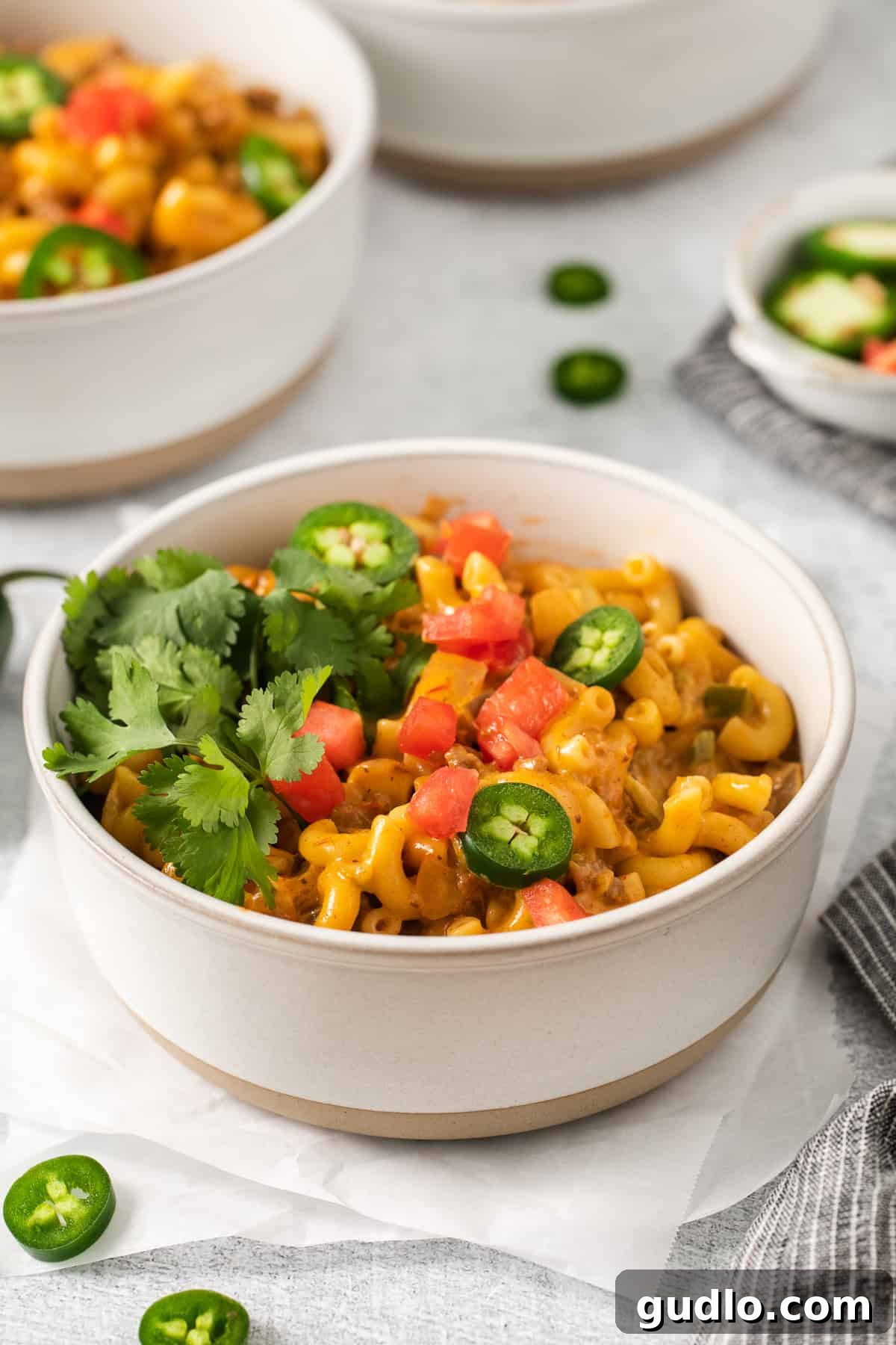 Delicious Taco Mac and Cheese Served in a Bowl A perfectly portioned bowl of taco mac and cheese, garnished with fresh cilantro, ready to be devoured.