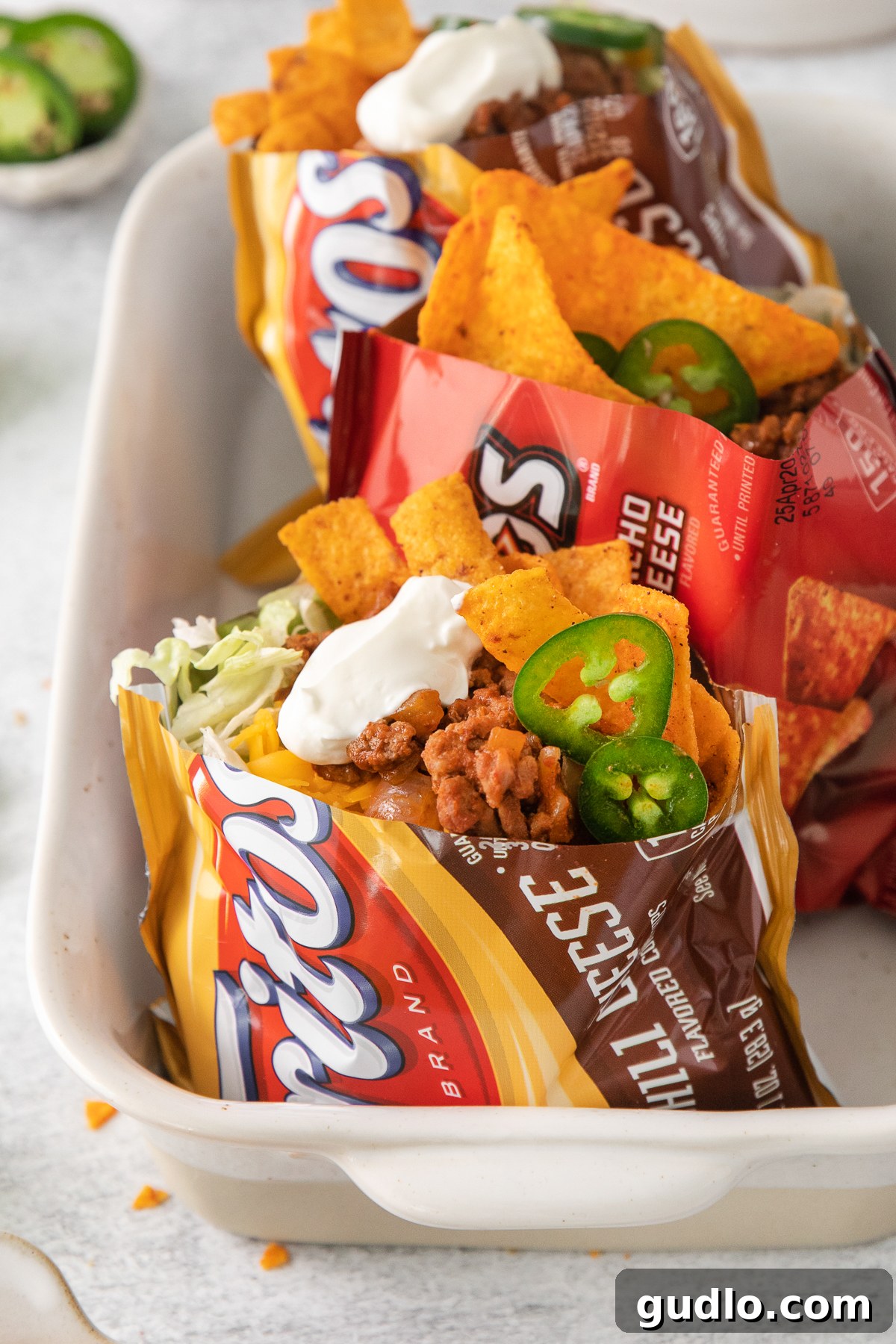 Easy Walking Taco Recipe: Your Go-To for Parties & Quick Meals walking tacos assembled in chip bags.
