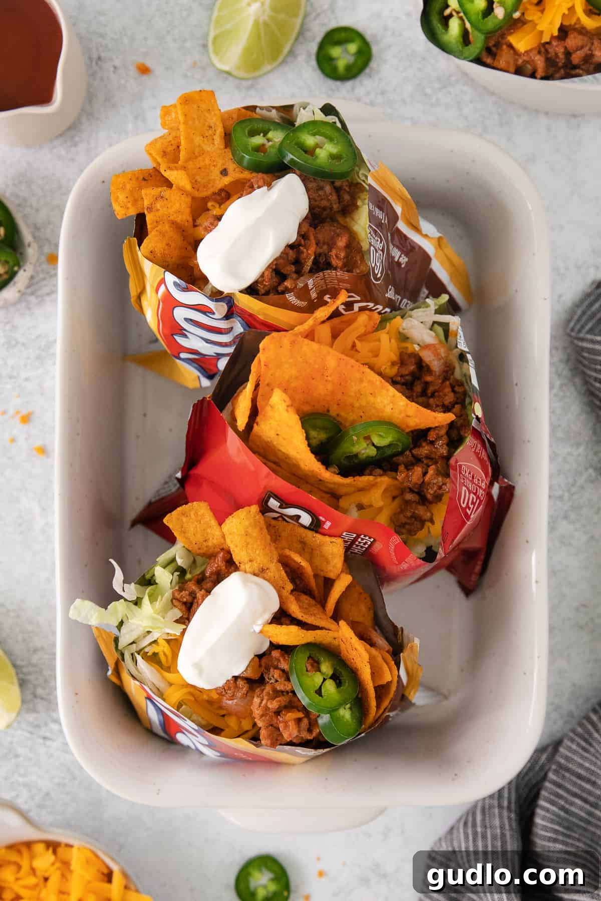 Serving Walking Tacos Family Style Walking tacos in a casserole dish.