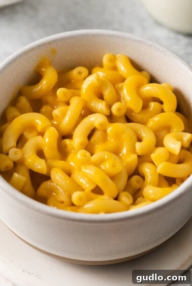 macaroni and cheese in a white bowl.