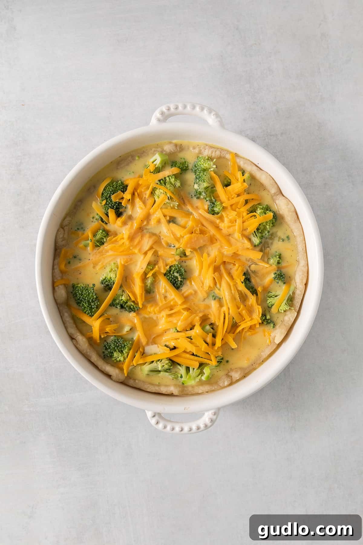 A baked broccoli and cheese casserole, hot out of the oven, showcasing its golden crust and bubbly cheese.