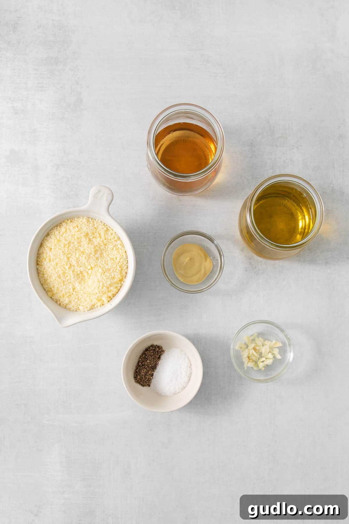 A vibrant table setting featuring multiple bowls filled with various delicious foods, showcasing the versatility of the dressing.