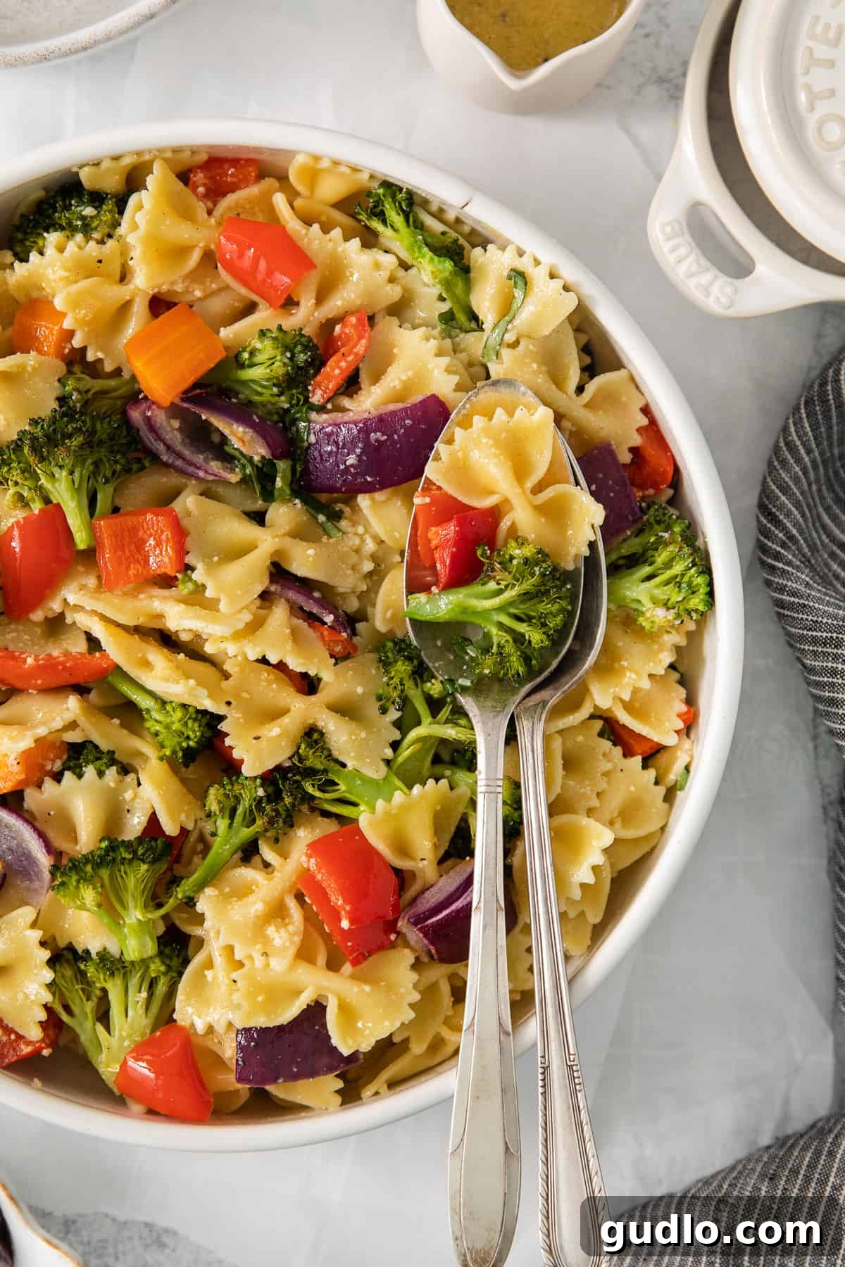 Farfalle Fiesta Salad 2 a bowl of pasta salad with a spoon.