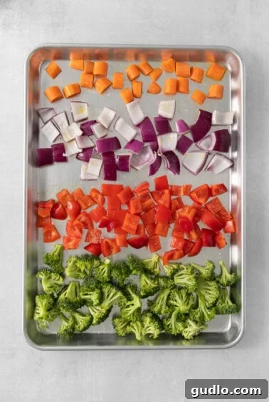 Farfalle Fiesta Salad 10 a tray of chopped vegetables including broccoli and carrots.