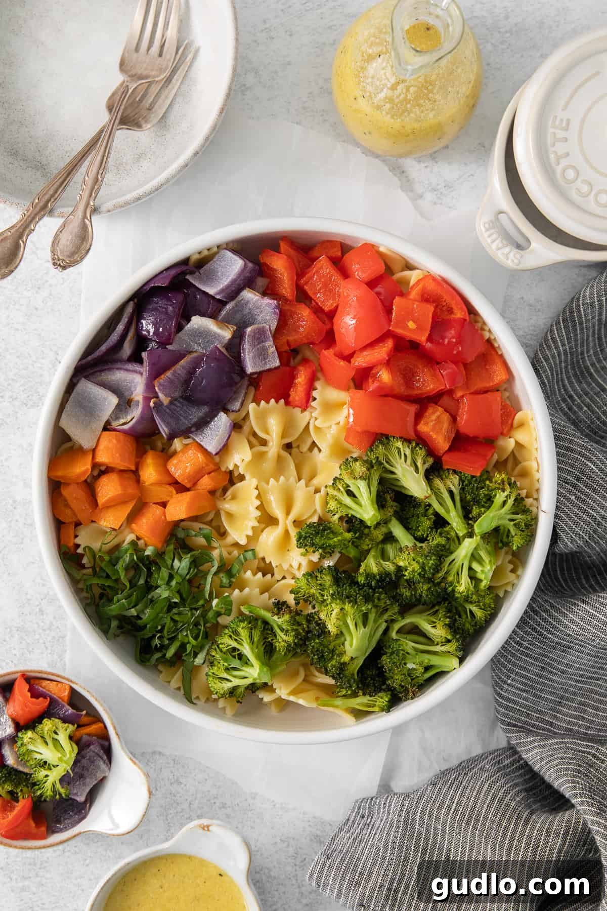 Farfalle Fiesta Salad 6 a white bowl filled with pasta and vegetables.