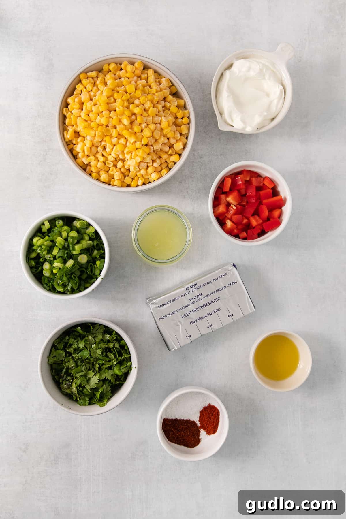 Ultimate Cream Cheese Corn Dip 3 A beautiful spread of appetizers on a table, including a bowl of the vibrant corn and cream cheese dip.