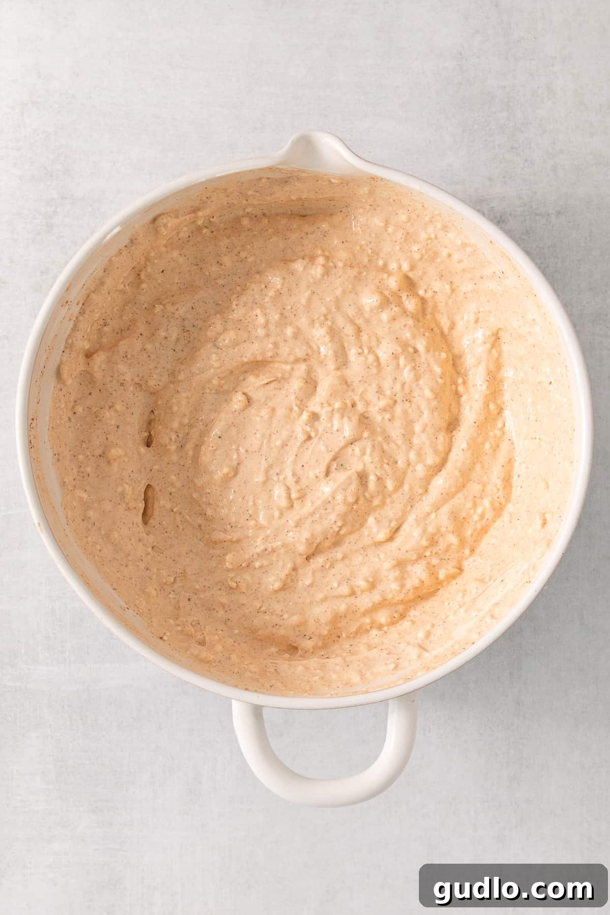 Ultimate Cream Cheese Corn Dip 4 A bowl of creamy, seasoned base mixture before adding the corn and vegetables for the dip.