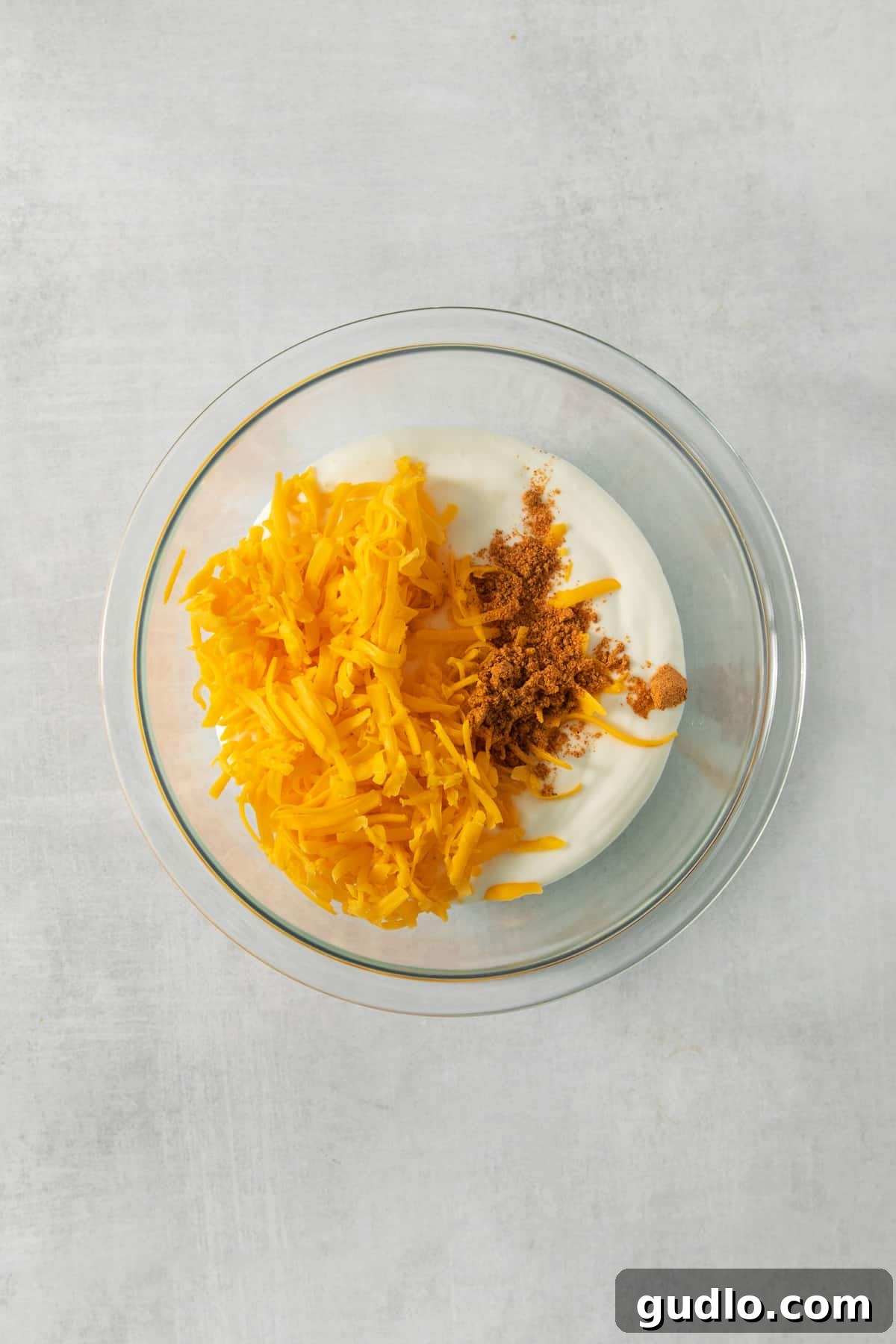 Creamy Protein Cottage Queso 4 A vibrant close-up shot of the blended cottage cheese, showcasing its smooth, creamy texture, ready to be transformed into a delicious queso dip.