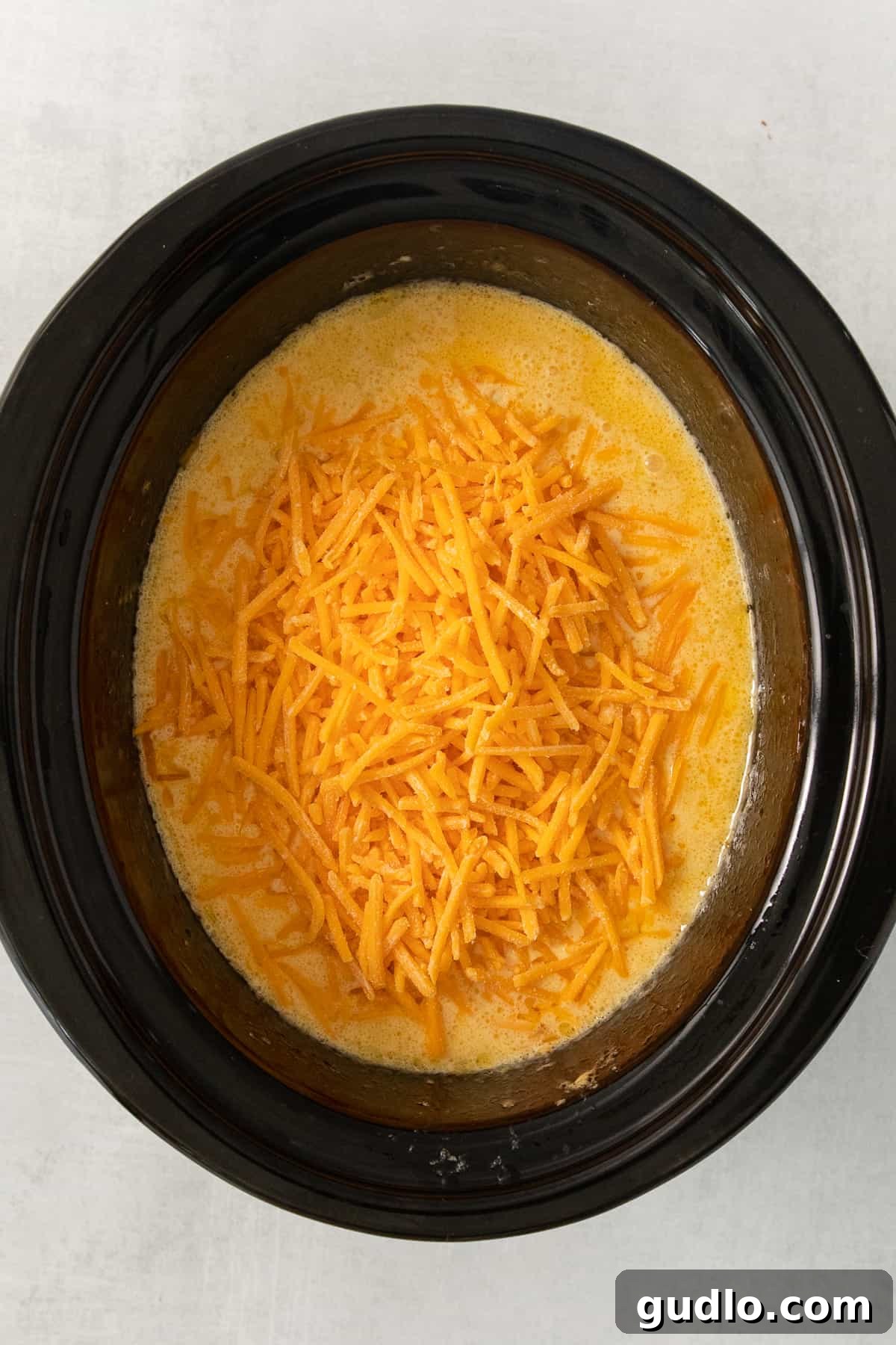 Ultimate Velveeta Crockpot Mac and Cheese 7 a bowl of cheesy chow mein in a slow cooker.