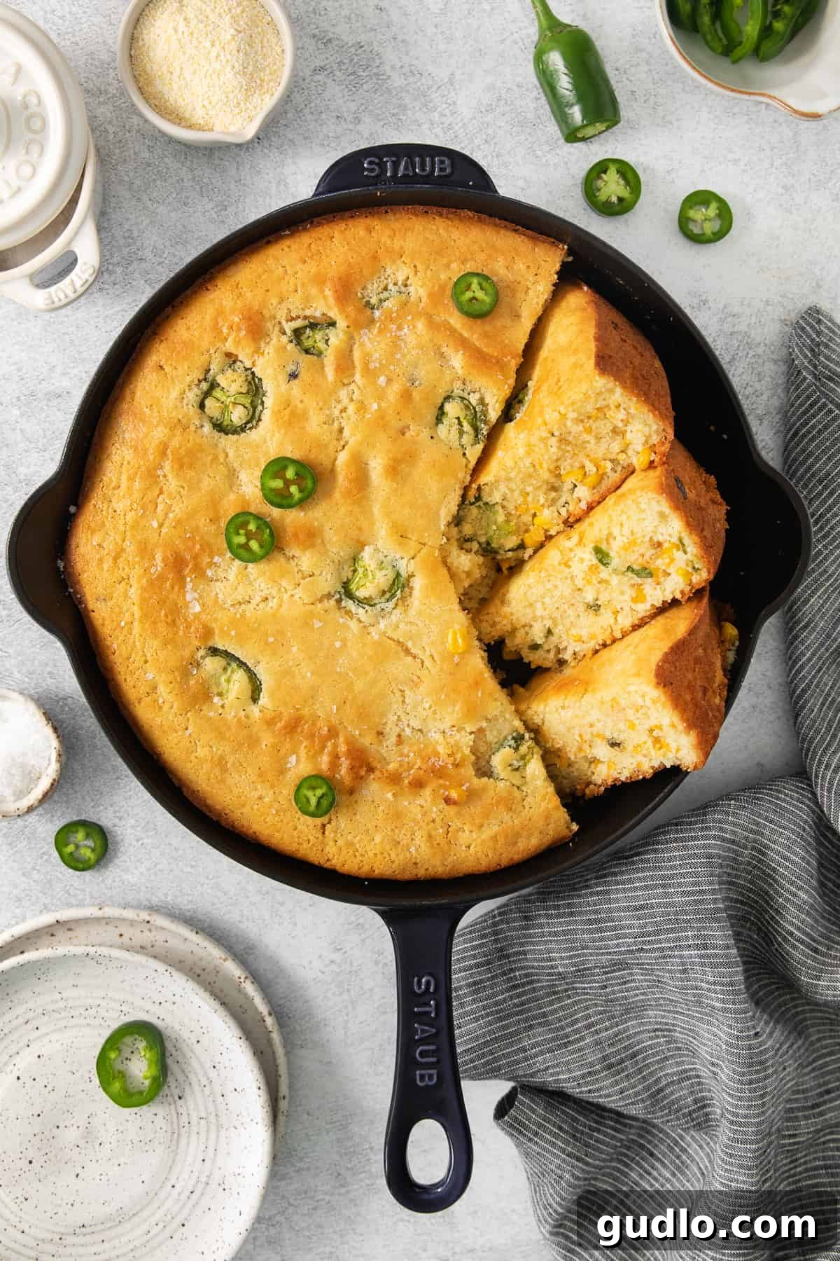 Kickin' Jalapeño Cheddar Cornbread 2 jalapeño cornbread in a cast iron skillet.