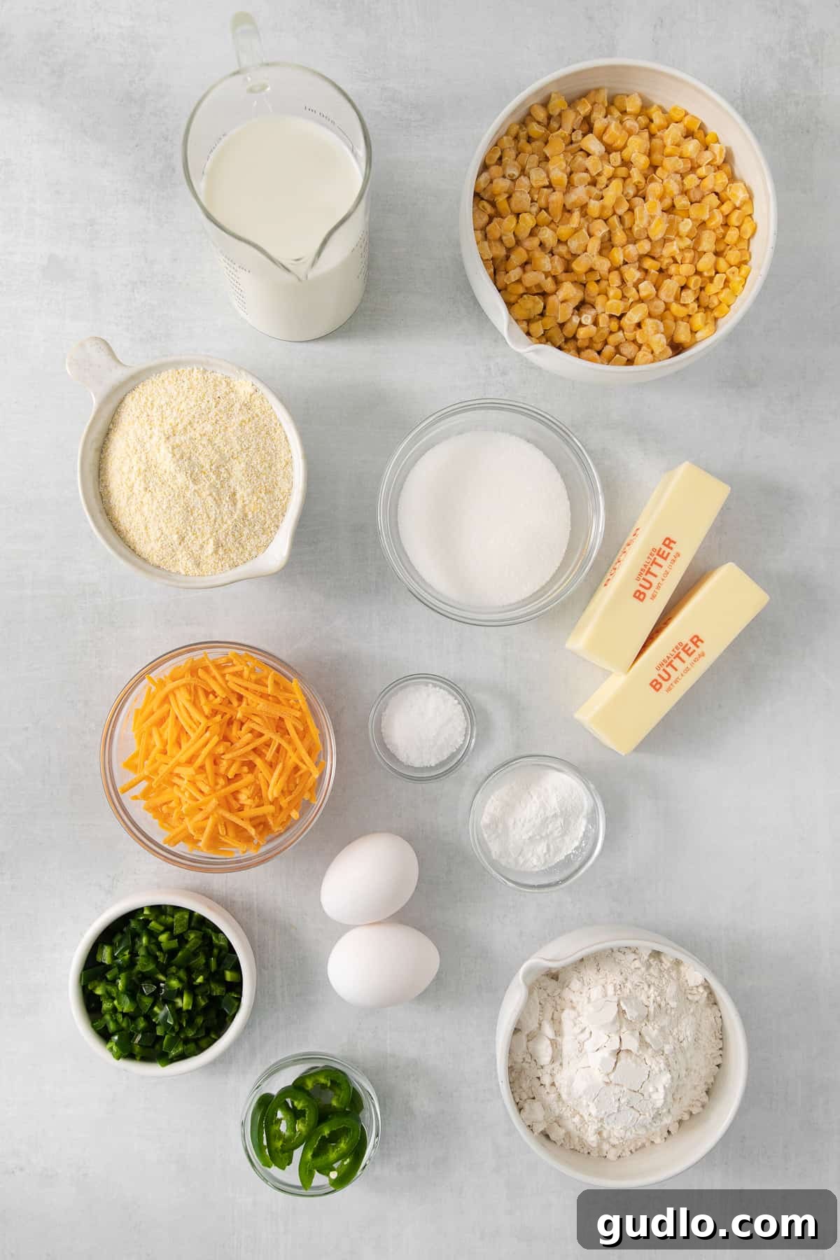 Kickin' Jalapeño Cheddar Cornbread 3 the ingredients for a cornbread recipe are laid out on a table.