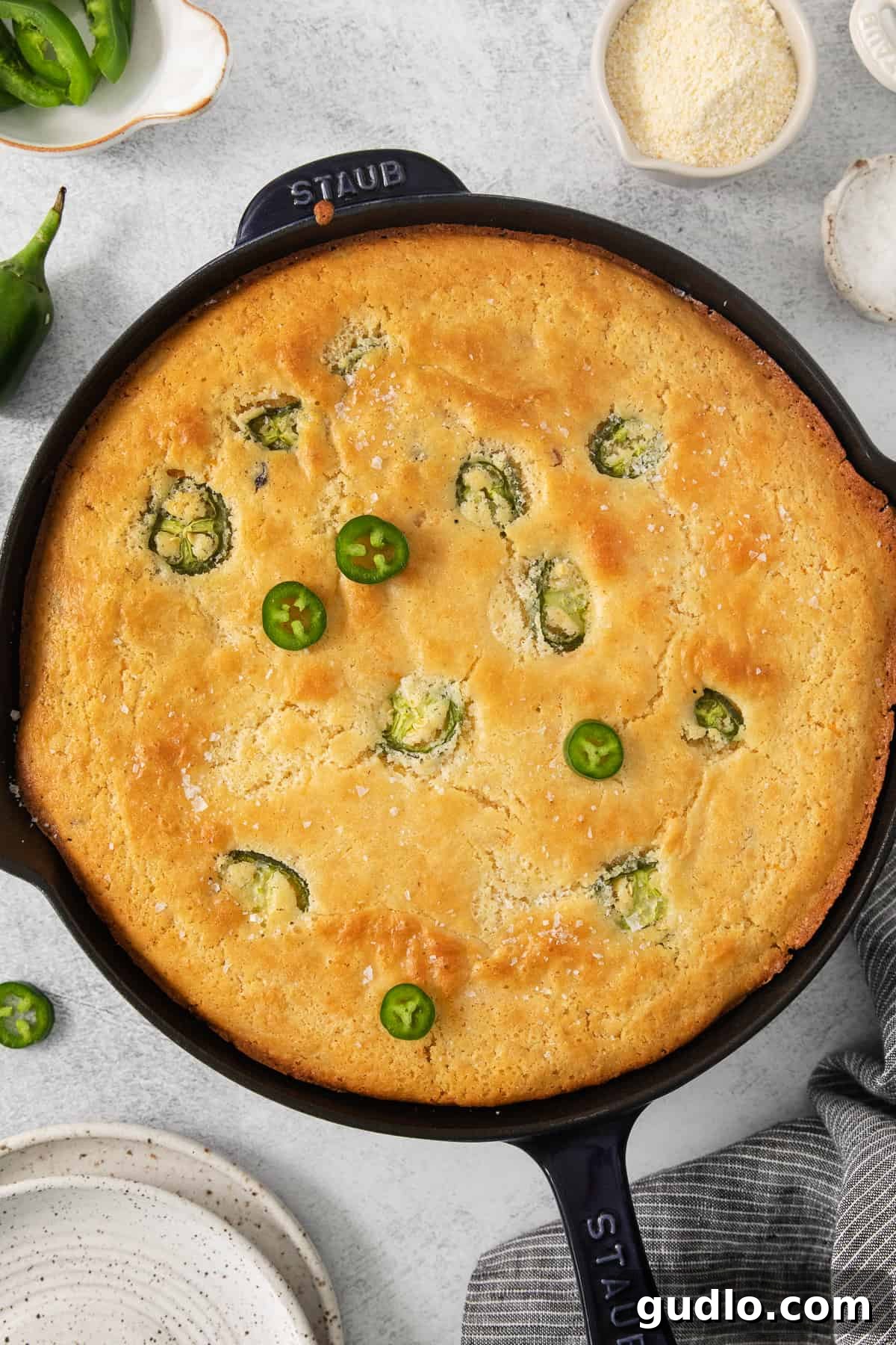 Kickin' Jalapeño Cheddar Cornbread 6 jalapeño cornbread in a cast iron skillet.