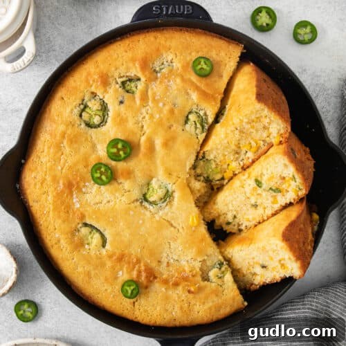 Kickin' Jalapeño Cheddar Cornbread 7 jalapeño cornbread in a cast iron skillet.