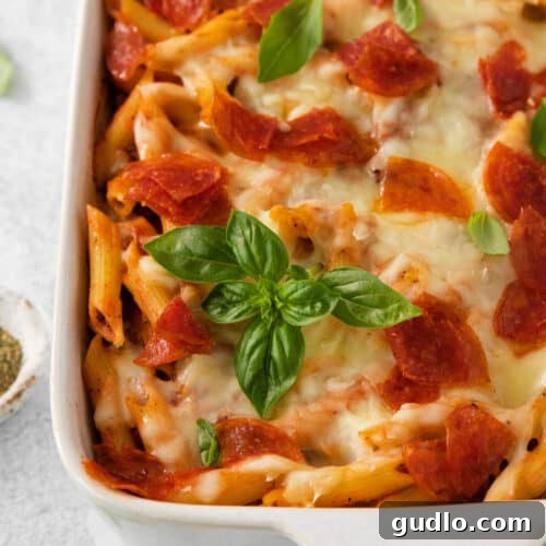 A casserole dish with pepperoni and cheese, showcasing the finished product.