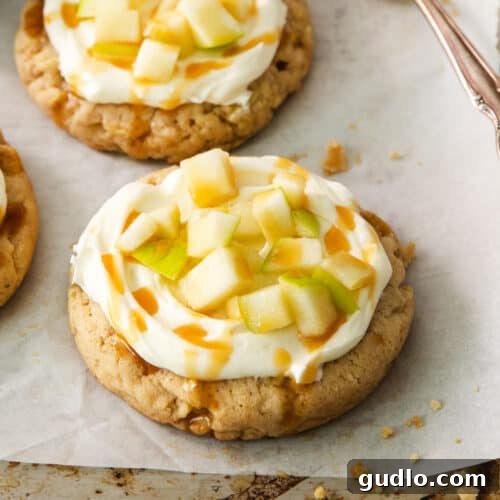 A close-up view of a cream cheese caramel apple cookie, showcasing its delectable texture and toppings.