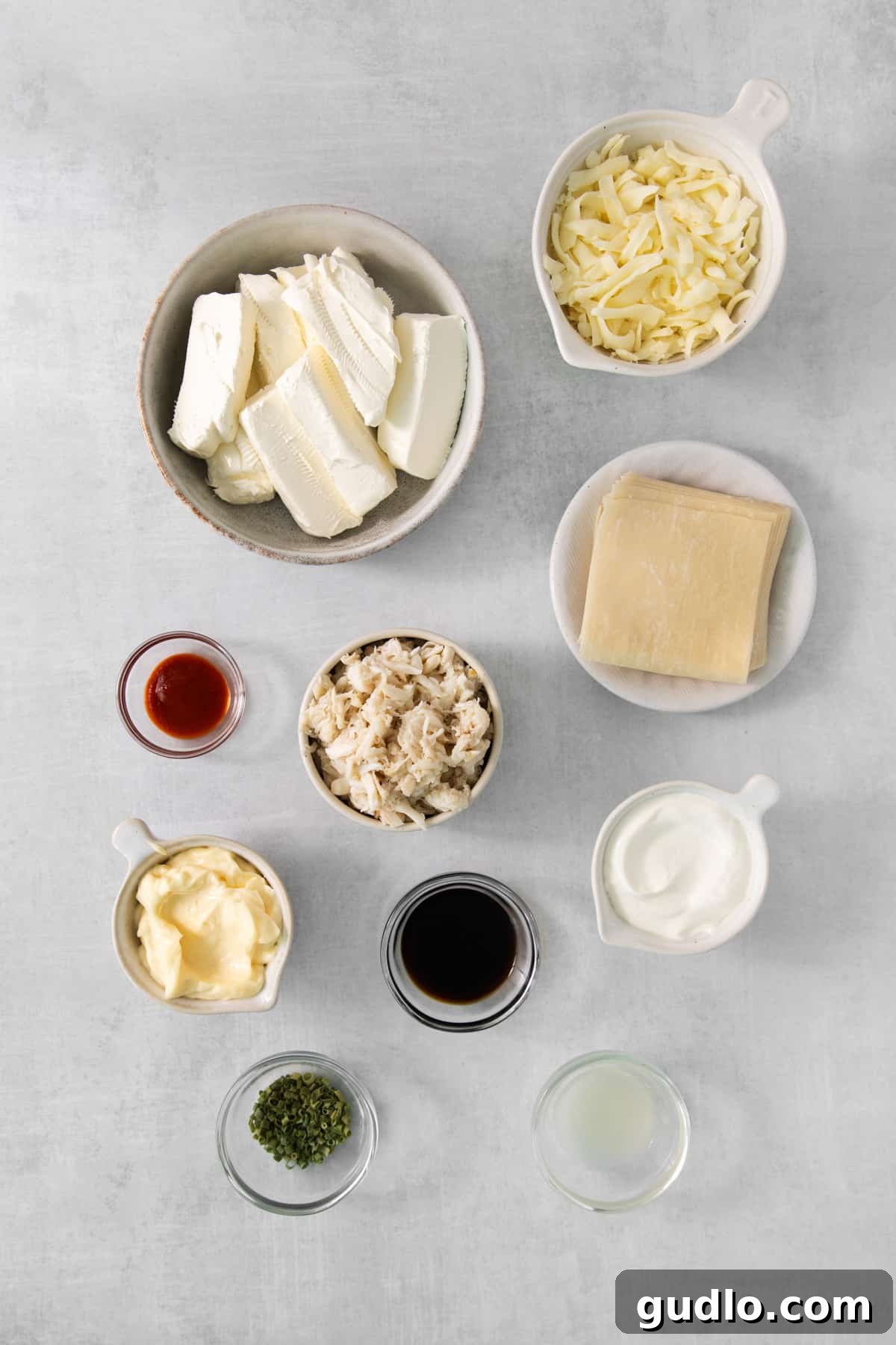 Deconstructed Crab Rangoon Dip 5 An organized display of fresh and packaged ingredients, including cream cheese, spices, and crab meat, ready for making the delicious crab rangoon dip.