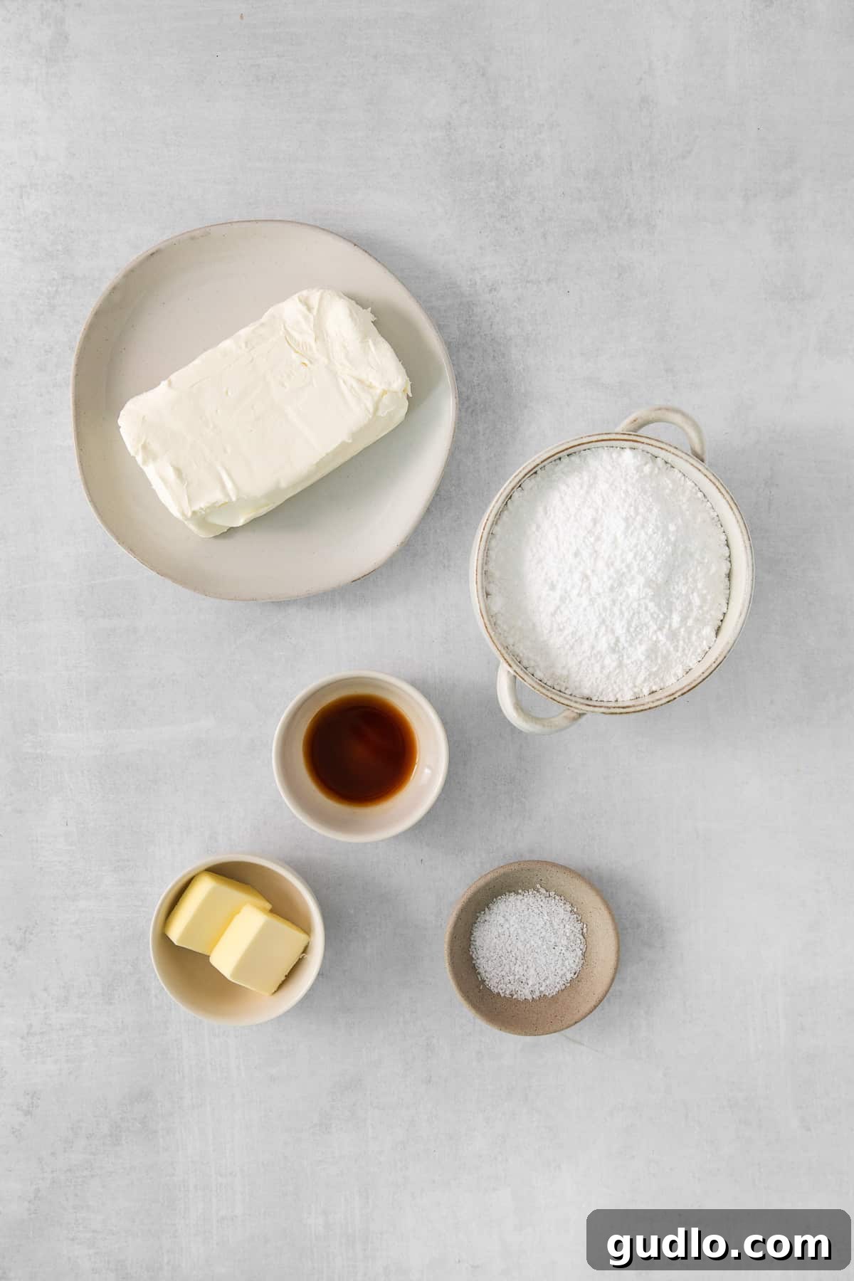 Lush Cream Cheese Frosting for Cinnamon Rolls 4 A beautifully set rustic table adorned with various breakfast and dessert items, including pastries, fruit, and beverages, perfect for a festive gathering.