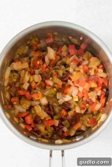 Quick Velveeta Queso: Ready in 15 Minutes 10 A stainless steel bowl filled with chopped vegetables.