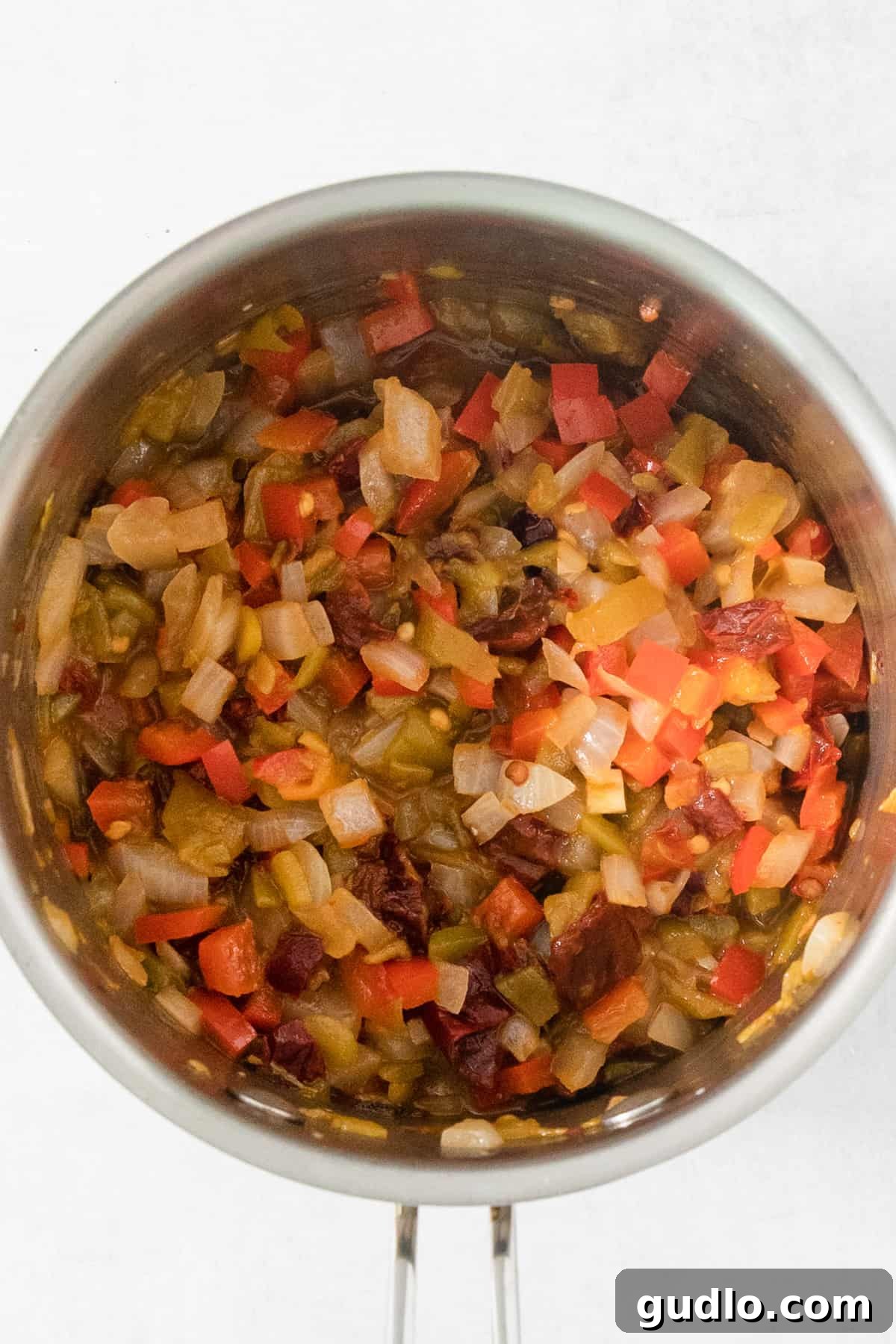 Quick Velveeta Queso: Ready in 15 Minutes 3 A stainless steel bowl filled with chopped vegetables.