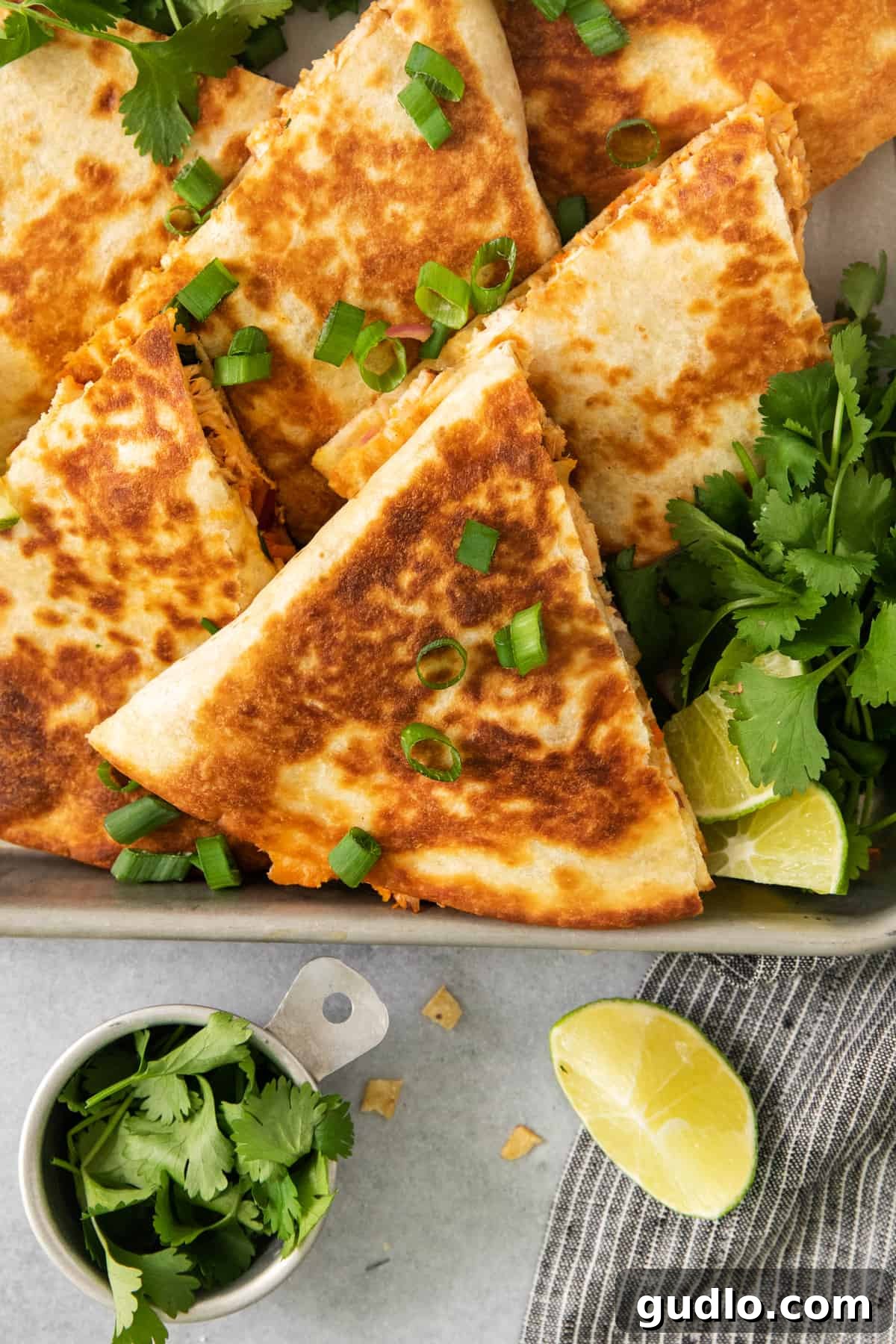Buffalo Chicken Quesadillas cooling on a baking sheet, showcasing their golden-brown perfection.