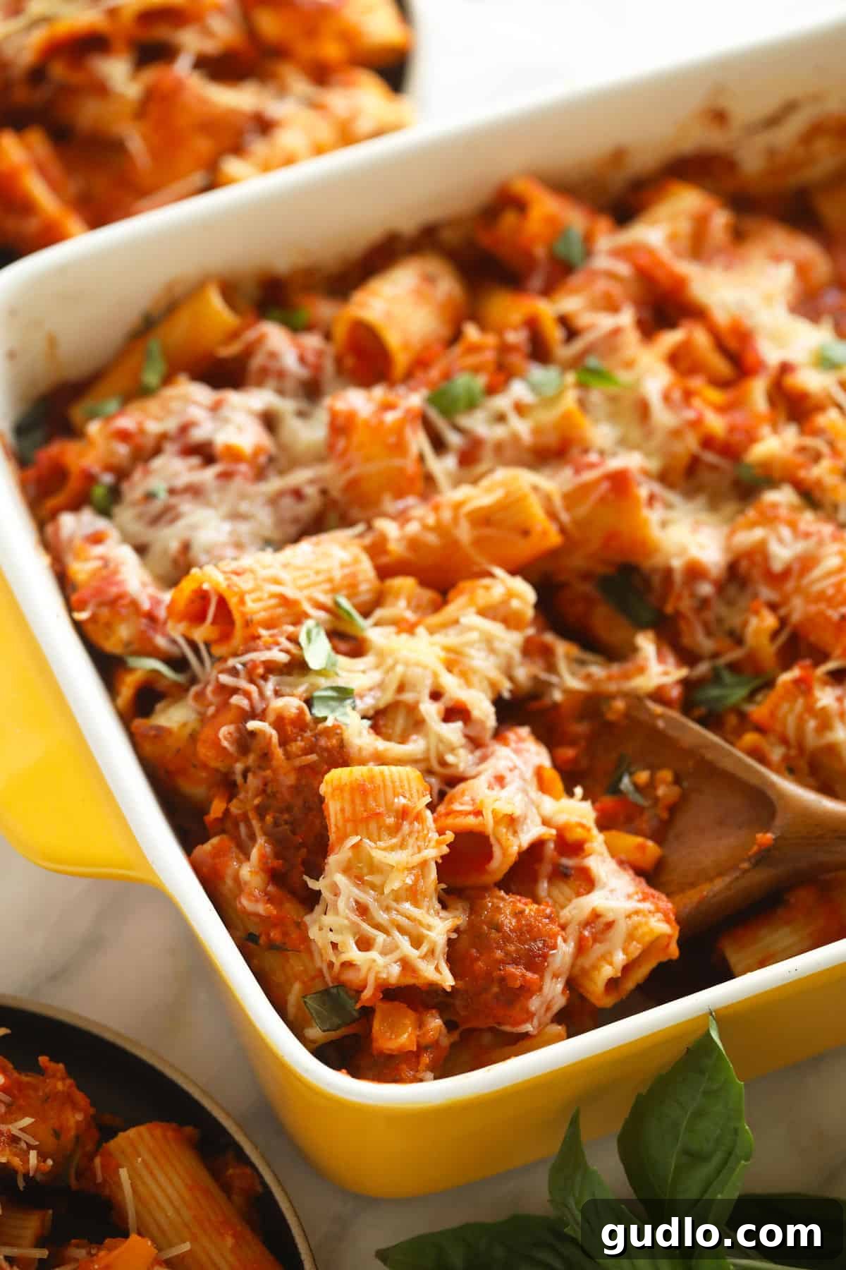 Ultimate Cheesy Chicken Parmesan Bake 2 Chicken parmesan casserole in a casserole dish.
