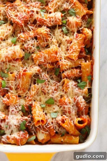 Baked chicken parmesan in a casserole dish.