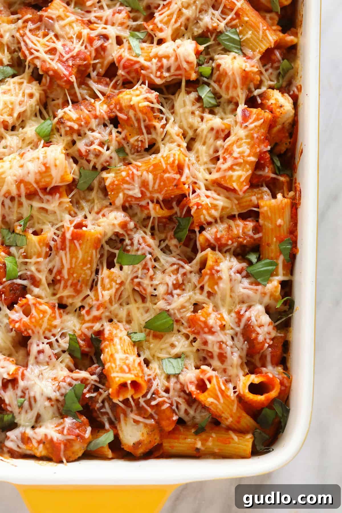 Ultimate Cheesy Chicken Parmesan Bake 5 Chicken parmesan casserole baked and in a casserole dish