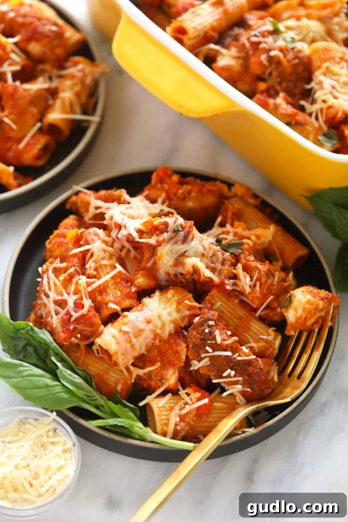 Ultimate Cheesy Chicken Parmesan Bake 7 Chicken parmesan casserole on a plate.