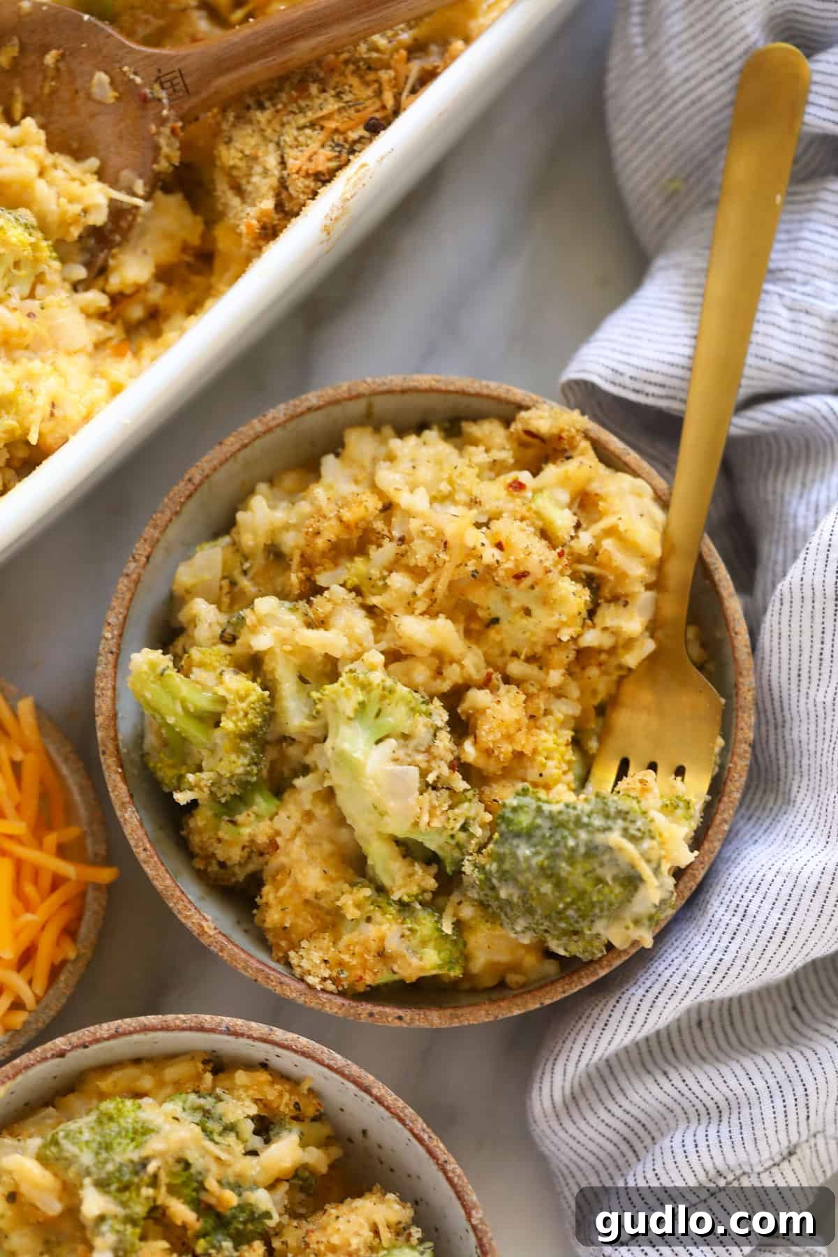 A bowl of hot, bubbling broccoli and cheese casserole, ready to be enjoyed.