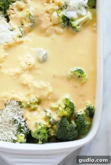 A casserole dish filled with broccoli and cheese.