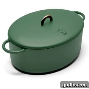 Velvety Broccoli & Cheddar 3 A green oval casserole with handles, perfect for Tuscan chicken mac and cheese.