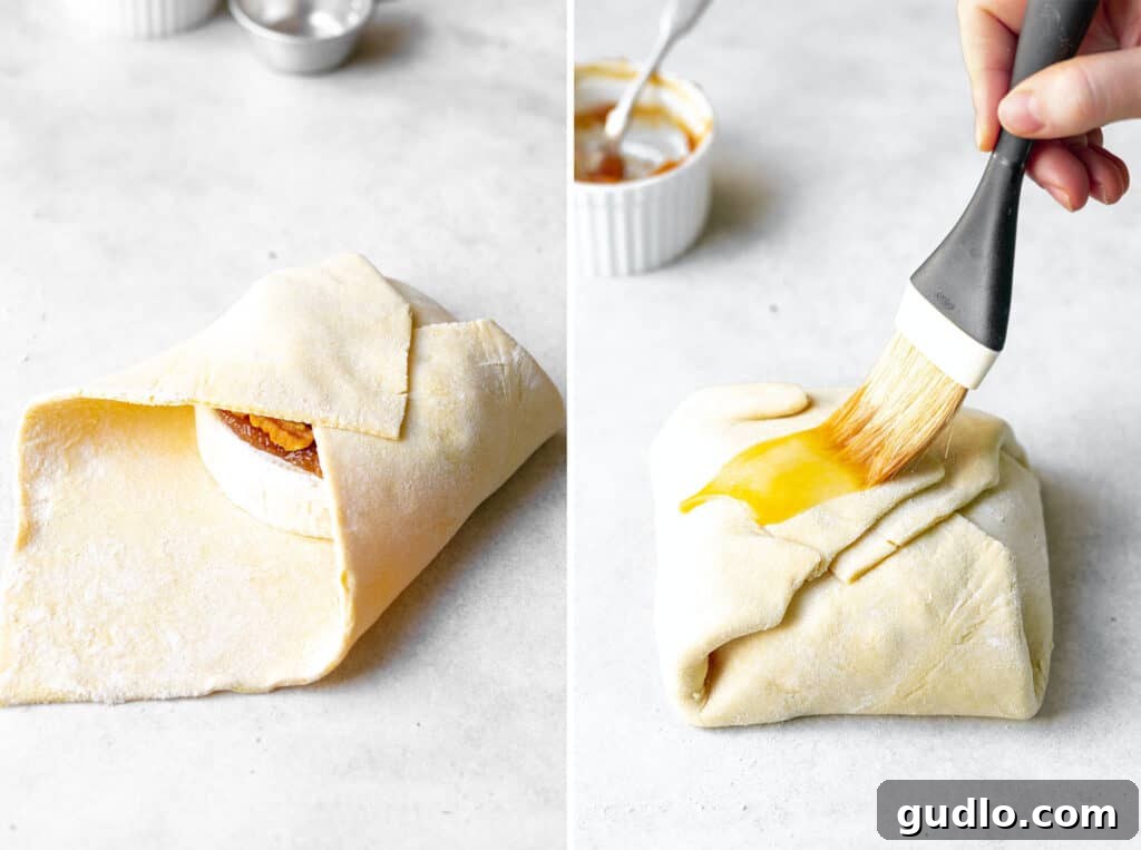 painting brie with egg wash before baking.