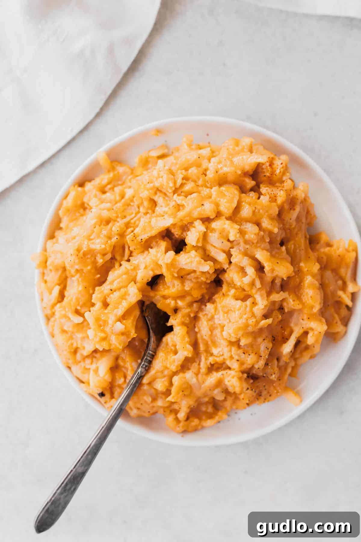 Decadent Slow Cooker Cheesy Potato Casserole 2 A large serving of creamy, golden crockpot cheesy potatoes, ready to be enjoyed.