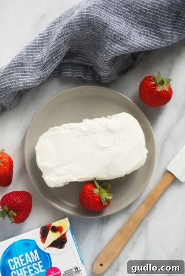 Cream cheese on a plate, ready for microwaving in short bursts.