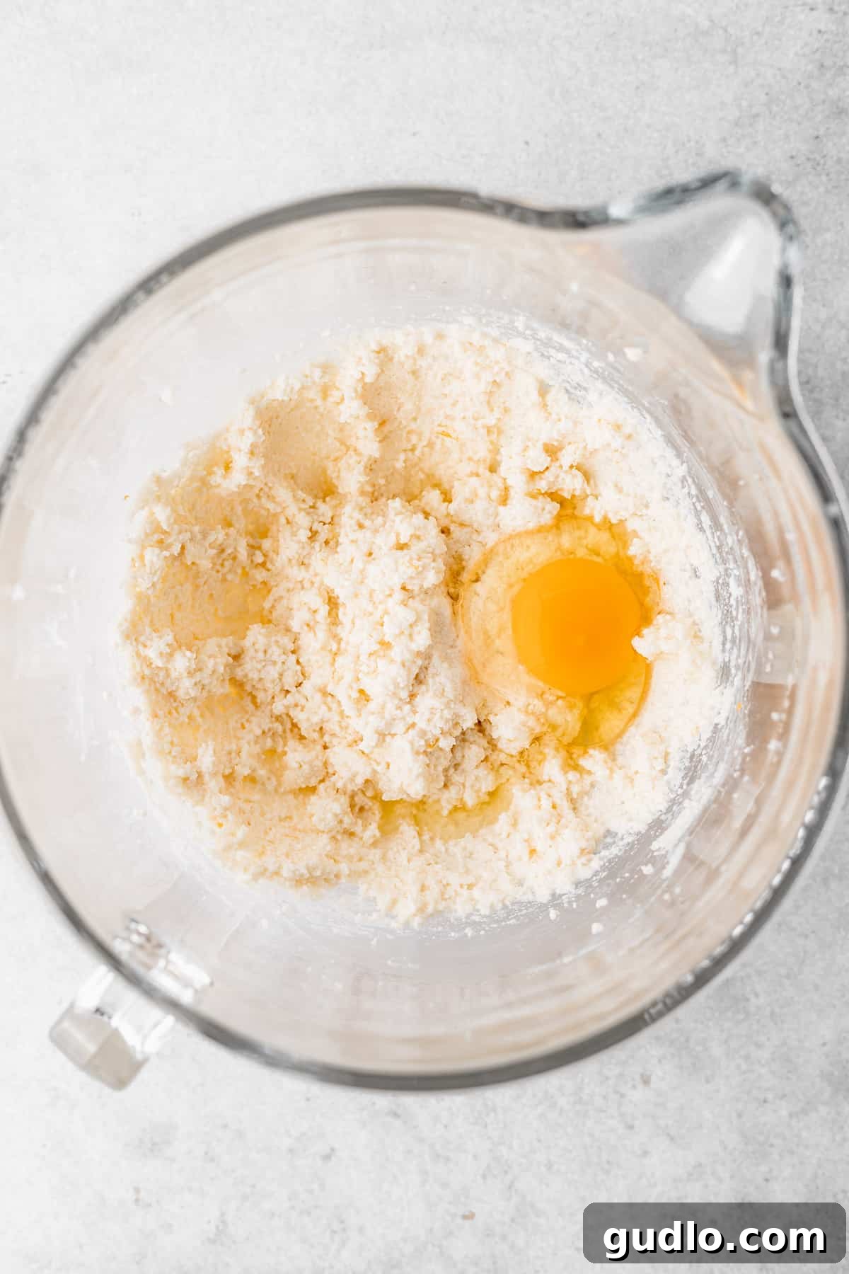 A collection of fresh ingredients, including ricotta cheese, butter, oranges, and eggs, ready to be transformed into delicious ricotta cookies.