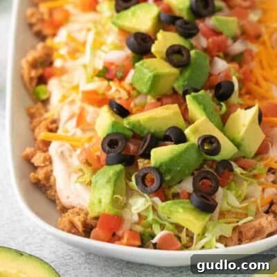 7 layer dip on a plate.